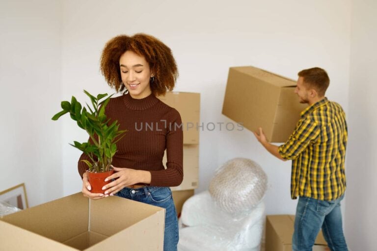 A couple busy packing for their house move